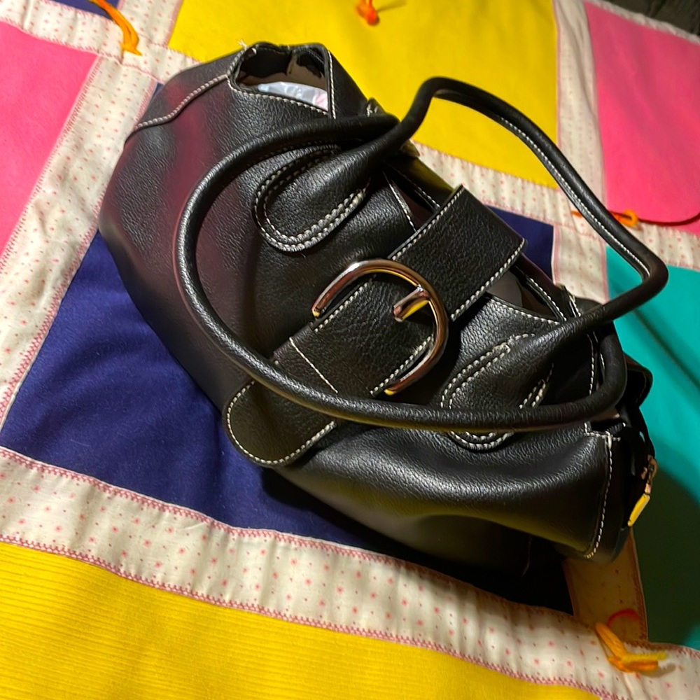 Black with white stitch with silver zipper & buckle